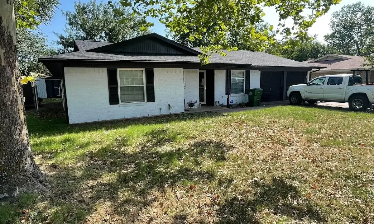 Professional roofing crew working on a residential roof in Mesquite